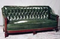 TUFTED LEATHER CLUB SOFA WITH CARVED MAHOGANY ARMS AND COLUMNS