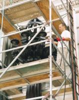 CONSERVATOR APPLYING PATINA TO THE LIGHT STANDARDS LOCATED AT THE CAPITOL'S MAIN ENTRANCE